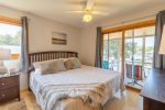 Main/Upper Level Bedroom 1 with King Bed, TV & walkout to Screened Deck